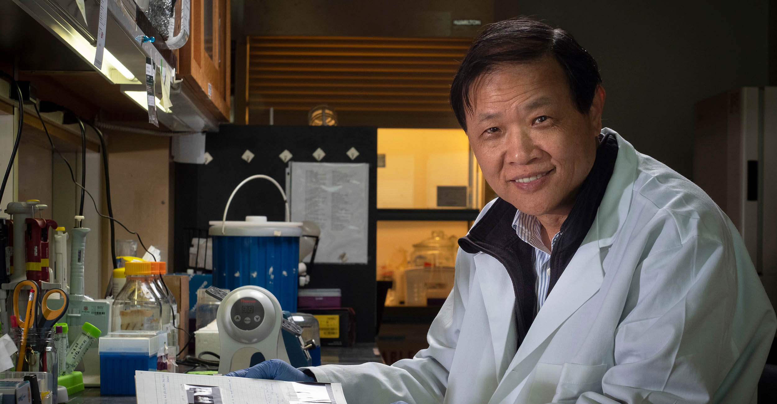 Posed image of Liuling Yan in his laboratory.