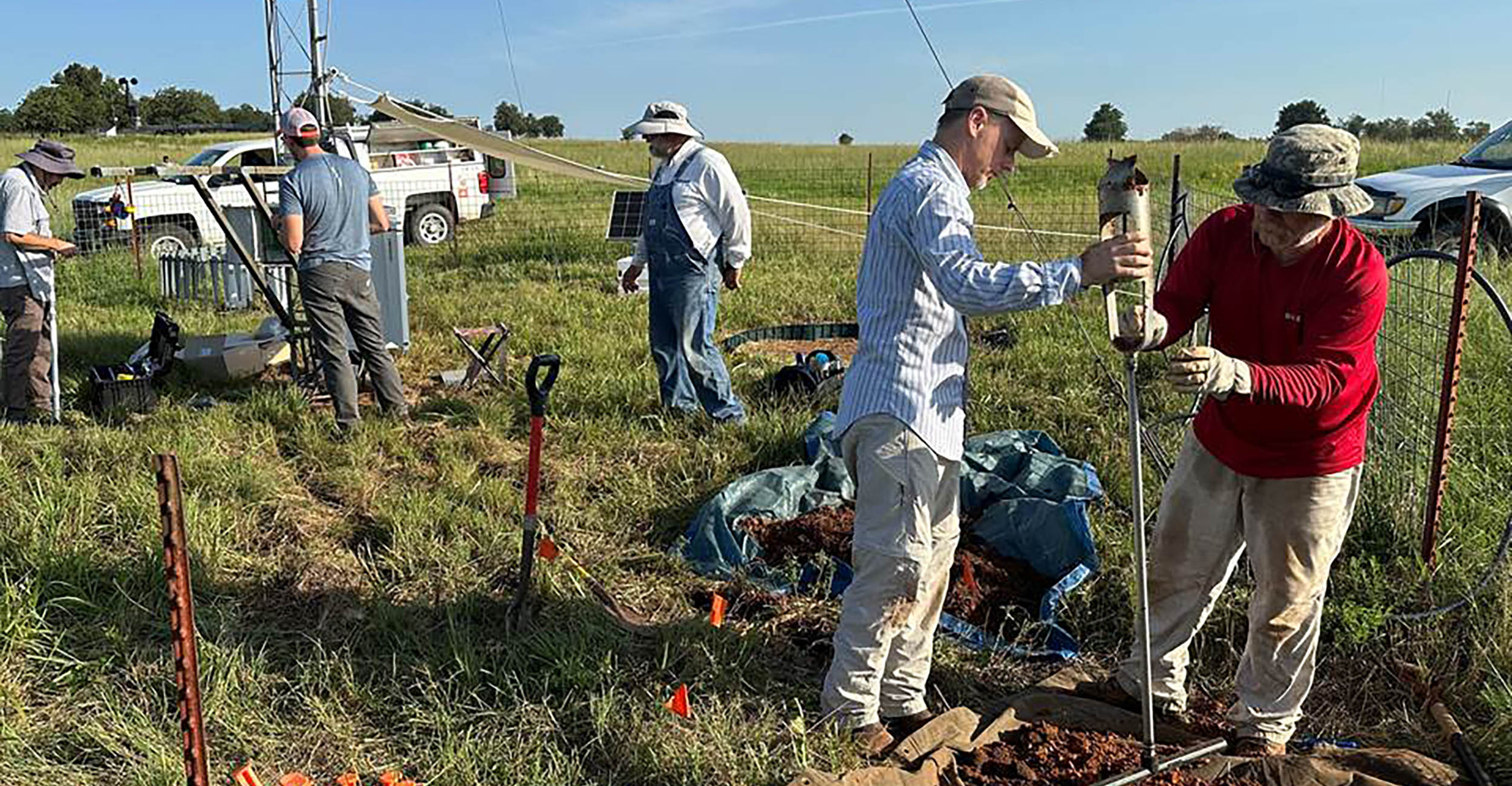 Researchers from Oklahoma State University and the University of Oklahoma prepare to install new soil water content sensors at an Oklahoma Mesonet.