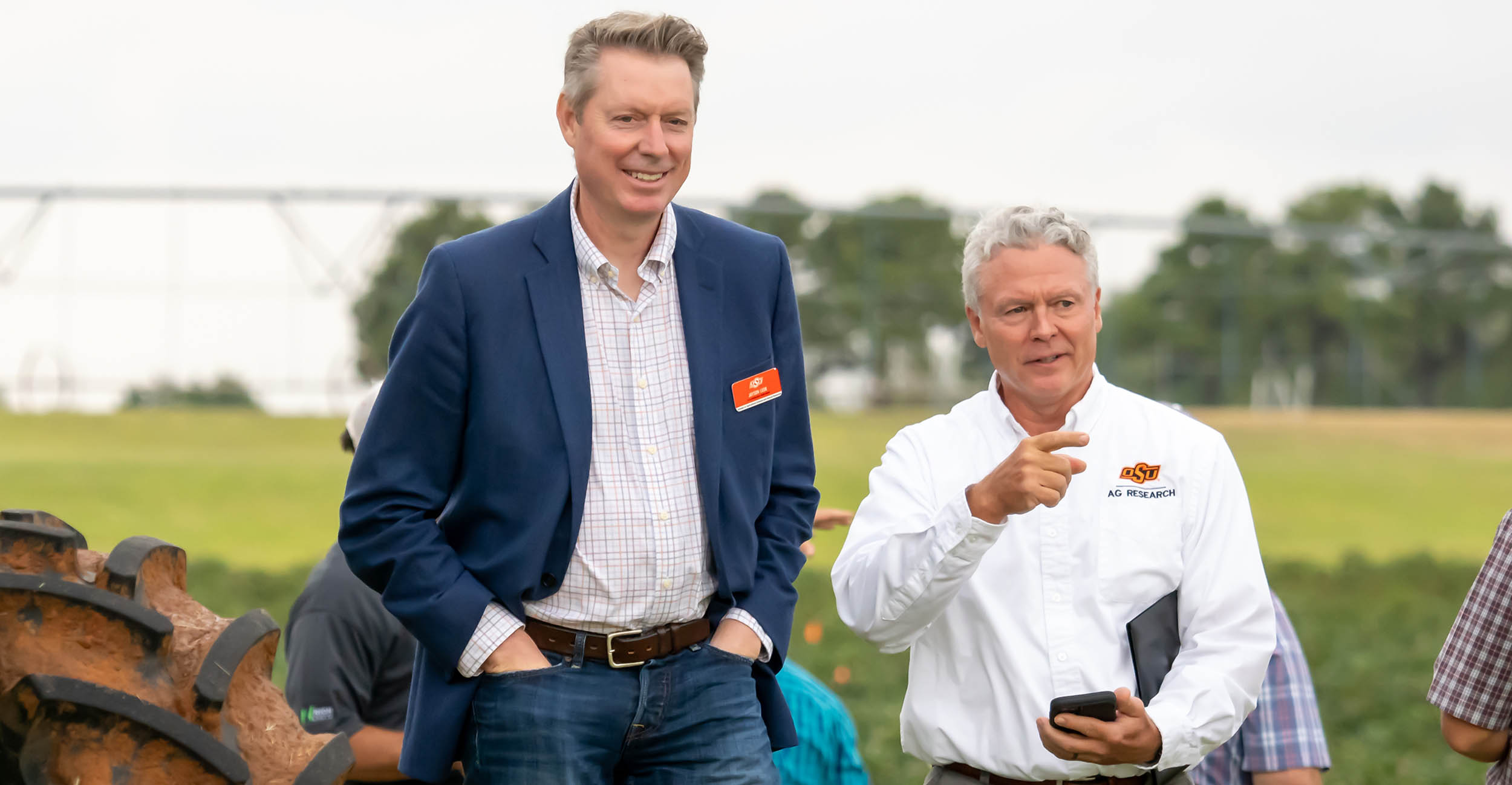 Jayson Lusk and Scott Senseman talking to each other at a field day in September 2023.