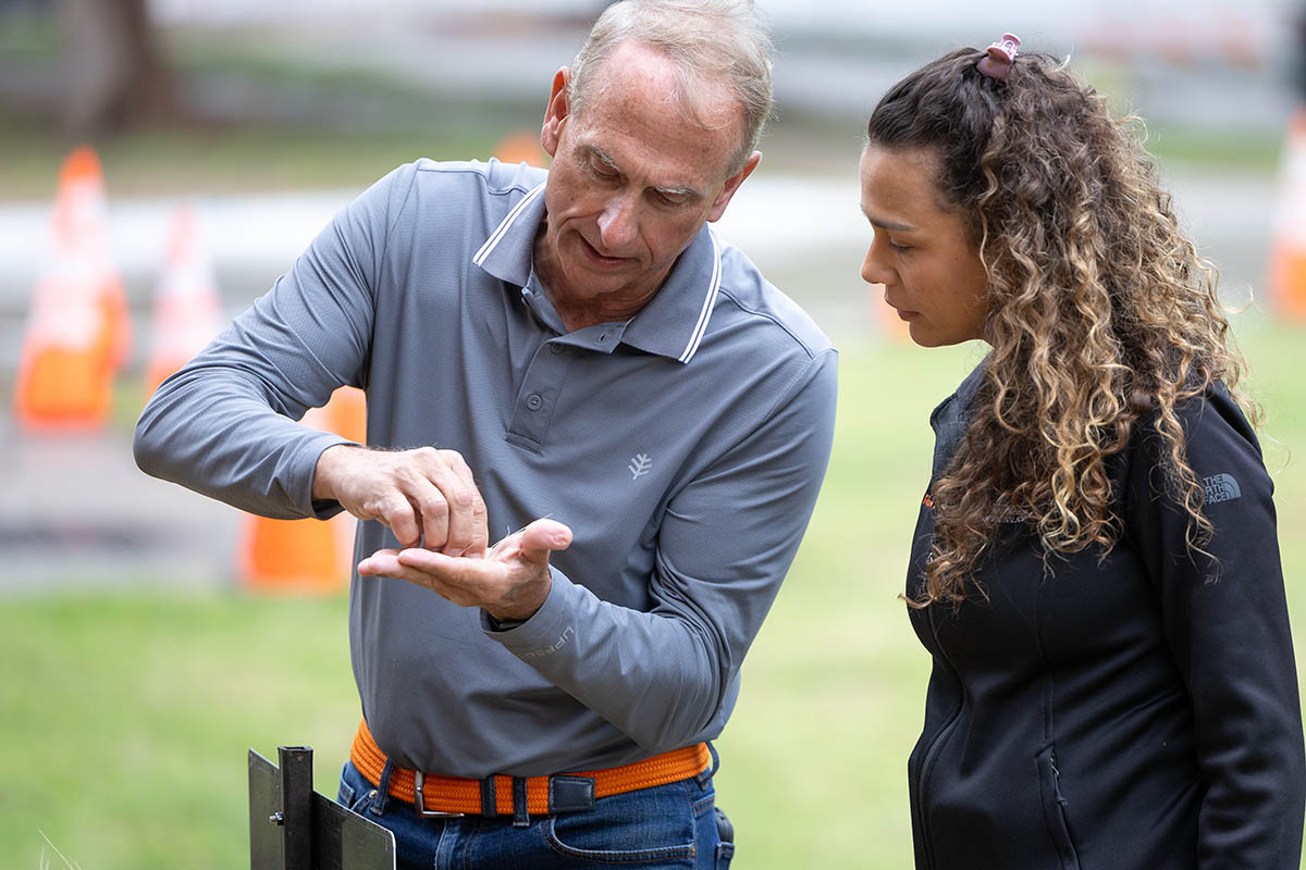 Brett Carver shows Amanda Silva purple wheat