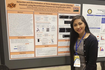 Andrea with student research poster